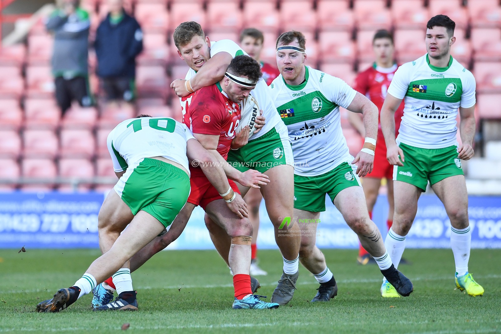 11th November 2018 , Racecourse Ground,  Wrexham, Wales ;  Rugby League World Cup Qualifier,Wales v Ireland ; Connor Davies of Wales is tackled by Liam Byrne of Ireland 


Credit:   Craig Thomas/News Images