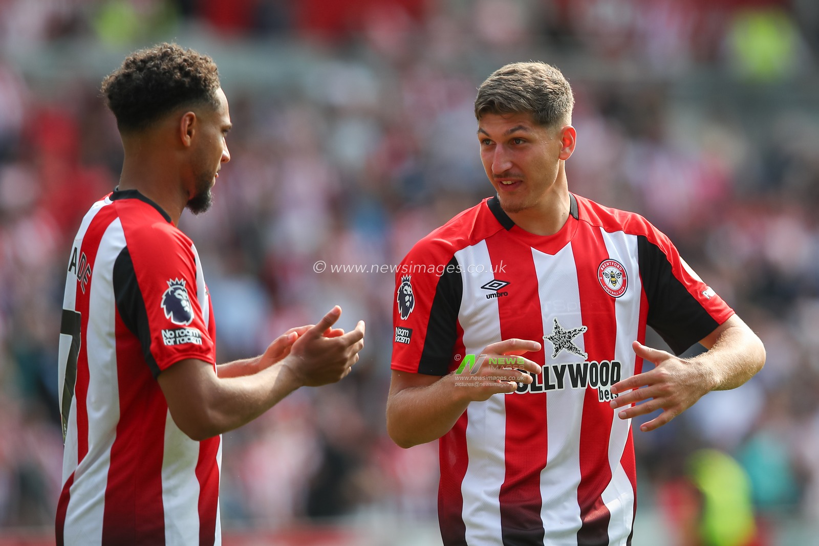Vitaly Janelt of Brentford speaks with Kevin Schade of Brentford at full time during the Premier League match Brentford vs Crystal Palace at The Gtech Community Stadium, London, United Kingdom, 18th August 2024

(Photo by Gareth Evans/News Images)