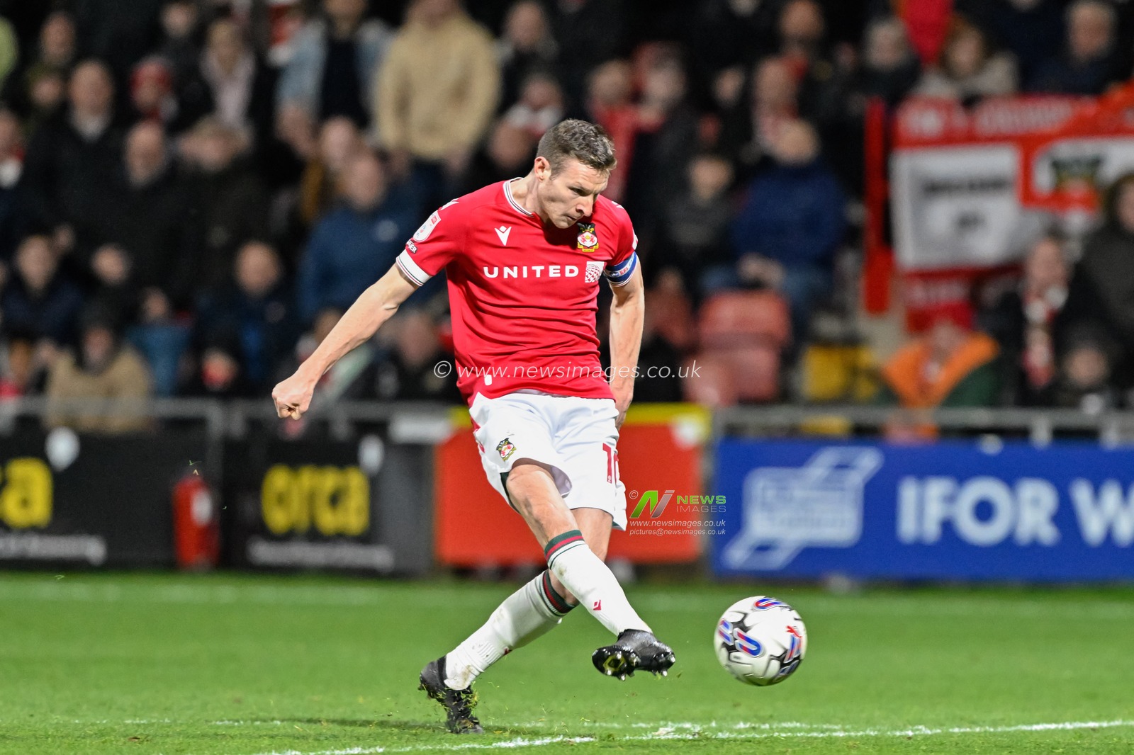 Paul Mullin of Wrexham strikes the ball to make it 4-0 Wrexham, during the Sky Bet League 2 match Wrexham vs Crawley Town at SToK Cae Ras, Wrexham, United Kingdom, 9th April 2024

(Photo by Cody Froggatt/News Images)