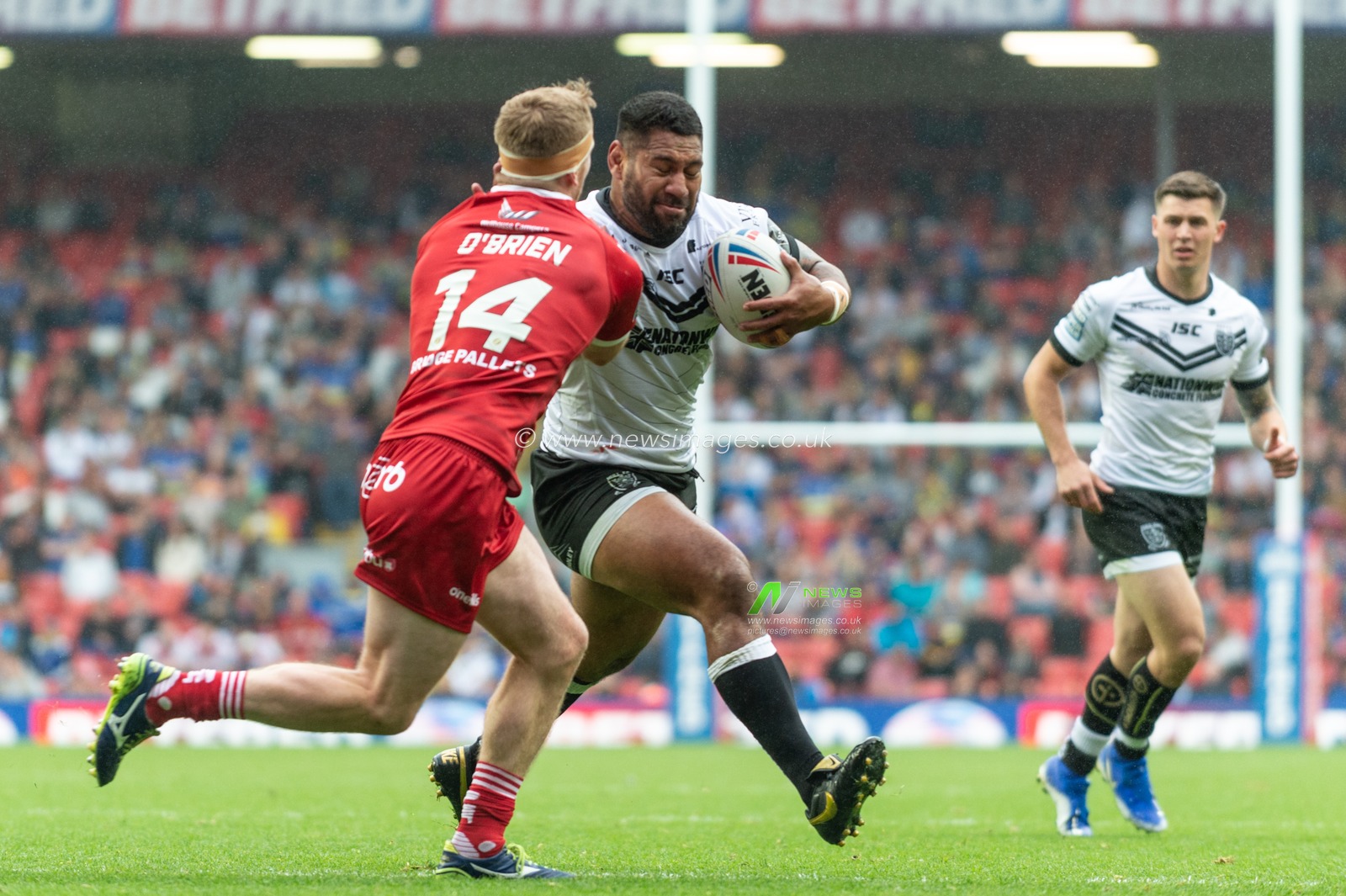 25th May 2019 , Anfield Stadium, Liverpool, England; Dacia Magic Weekend, Betfred Super League Round 16, Hull FC vs Huddersfield Giants ; Mickey Paea (23) of Hull FC is tackled by Adam Oâ€™Brien (14) of Huddersfield Giants 

Credit: Richard Long/News Images