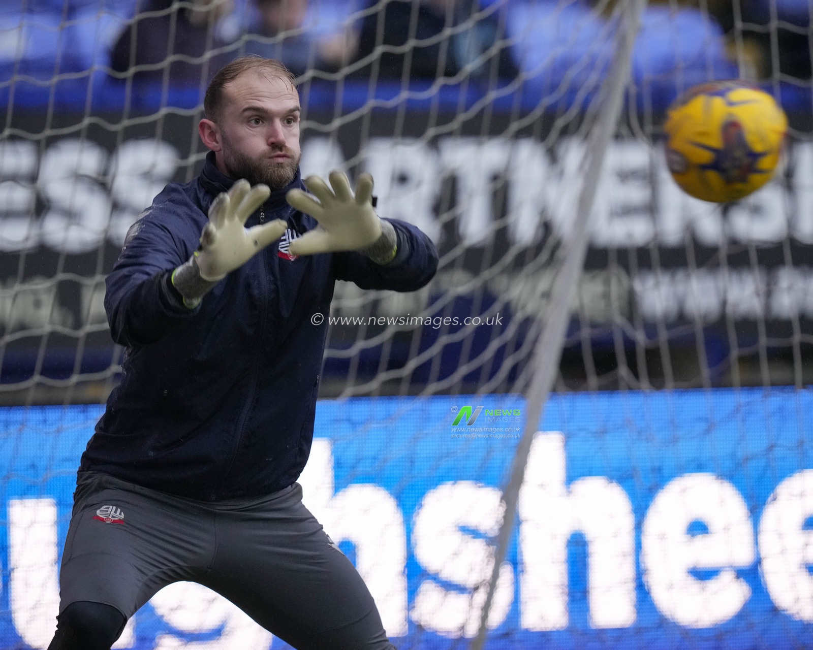 Joel Coleman of Bolton Wanderers warms up before the Sky Bet League 1 match Bolton Wanderers vs Cheltenham Town at Toughsheet Community Stadium, Bolton, United Kingdom, 13th January 2024

(Photo by Steve Flynn/News Images)