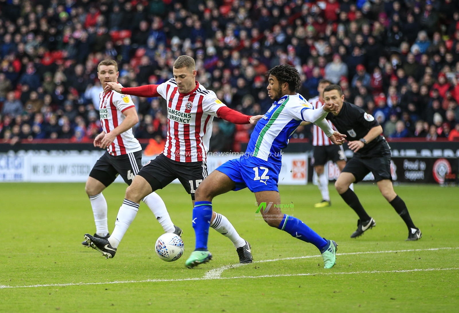 27th October 2018, Bramall Lane, Sheffield, England; Sky Bet Championship, Sheffield United v Wigan ; Paul Coutts (15) of Sheffield United challenges Reece James (12) of Wigan Athletic

Credit: Conor Molloy/News Images

English Football League images are subject to DataCo Licence