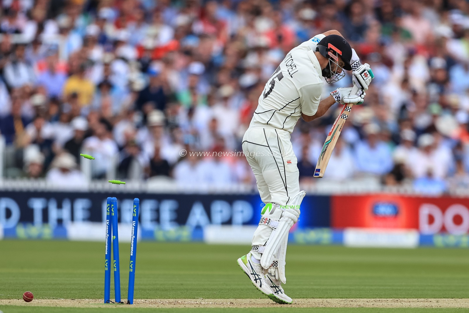 Daryl Mitchell #75 of New Zealand hits his own wickets as heâ€™s bowled by Matthew Potts of England