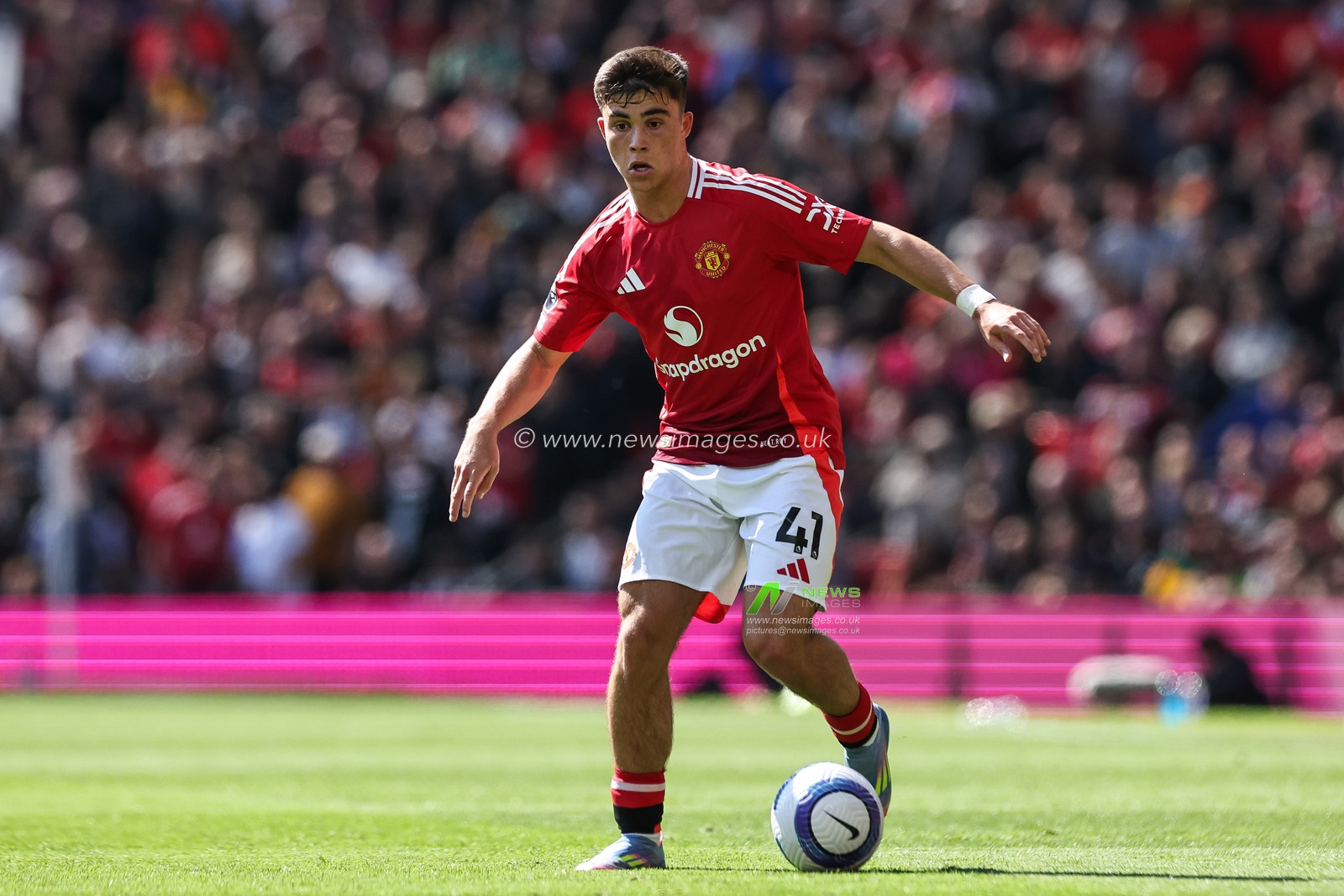 Harry Amass of Manchester United goes forward with the ball during the Premier League match Manchester United vs Wolverhampton Wanderers at Old Trafford, Manchester, United Kingdom, 20th April 2025

(Photo by Mark Cosgrove/News Images)