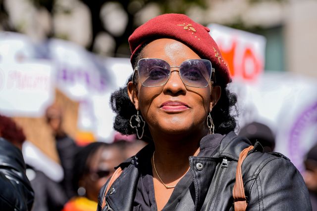 Development economist and activist Chenayi Mutambasere  looks on during Zimbabweans protest against the proposed constitution amendment at Embassy of Zimbabwe, London, United Kingdom on 18 April 2026

(Photo by Maynard Manyowa/News Images)