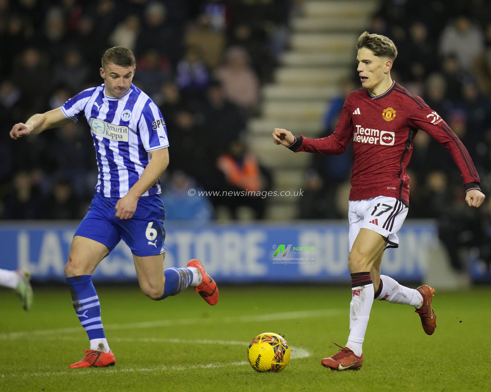Alejandro Garnacho of Manchester United runs at Charlie Hughes of Wigan Athletic during the Emirates FA Cup Third Round match Wigan Athletic vs Manchester United at DW Stadium, Wigan, United Kingdom, 8th January 2024

(Photo by Steve Flynn/News Images)