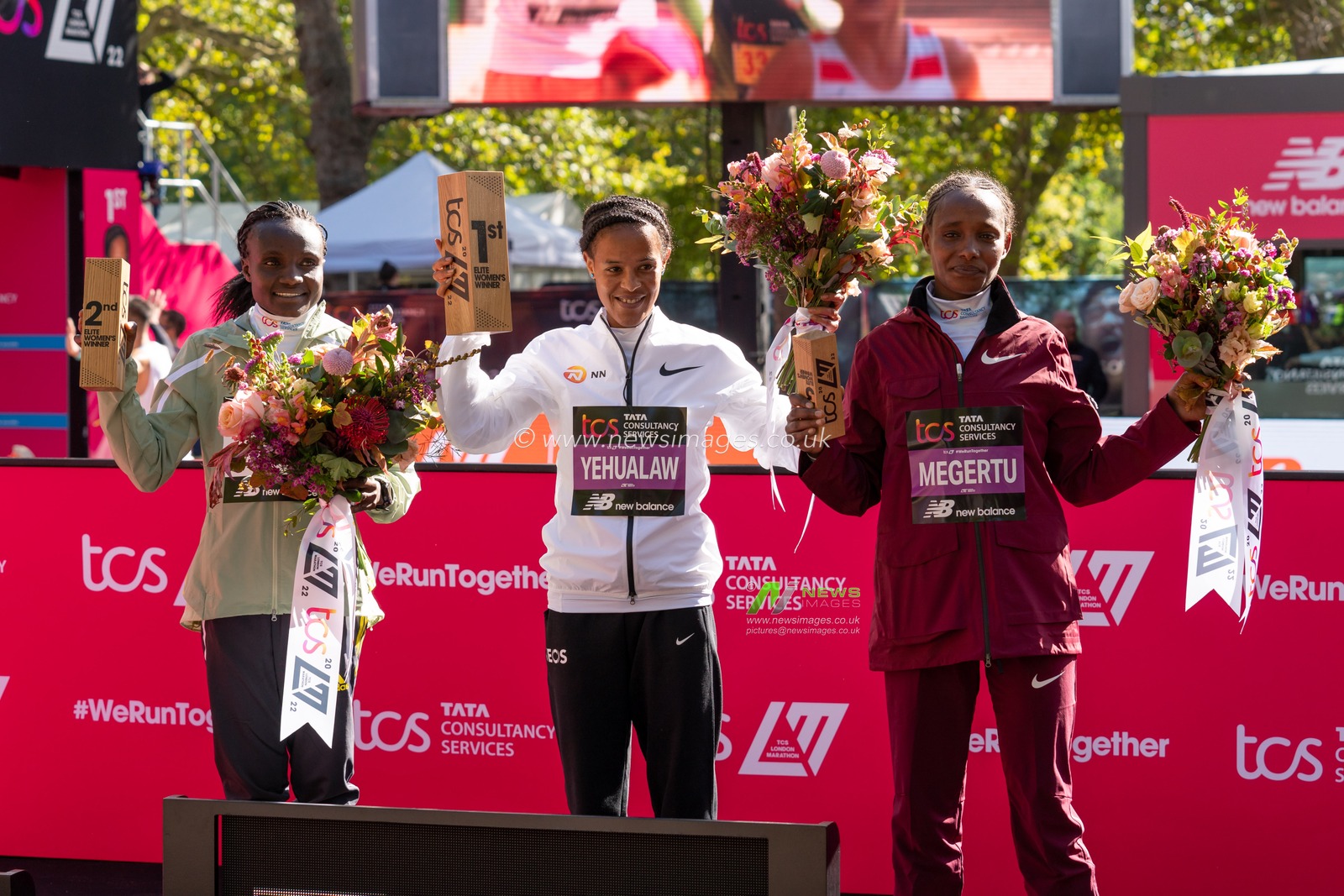 Winner of the Elite Womens Marathon Yelemzerf Yehualaw (ETH) centre time of 2:17:26 second Joyciline Jepkosgei (KEN) left.  third Alemu Megertu (ETH) right during the TCS London Marathon 2022 at London City Centre, London, United Kingdom, 2nd October 2022

(Photo by Richard Washbrooke/News Images)
