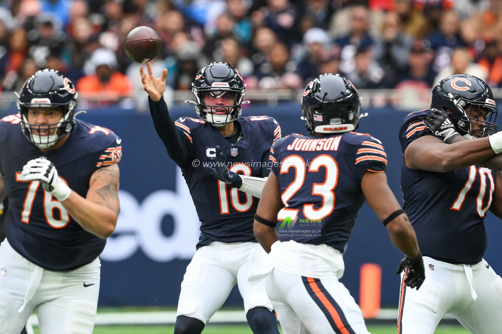 Caleb Williams of the Chicago Bears throws the ball to Roschon Johnson of the Chicago Bears during the Week 6 match Chicago Bears vs Jacksonville Jaguars at Tottenham Hotspur Stadium, London, United Kingdom, 13th October 2024

(Photo by Craig Thomas/News Images)