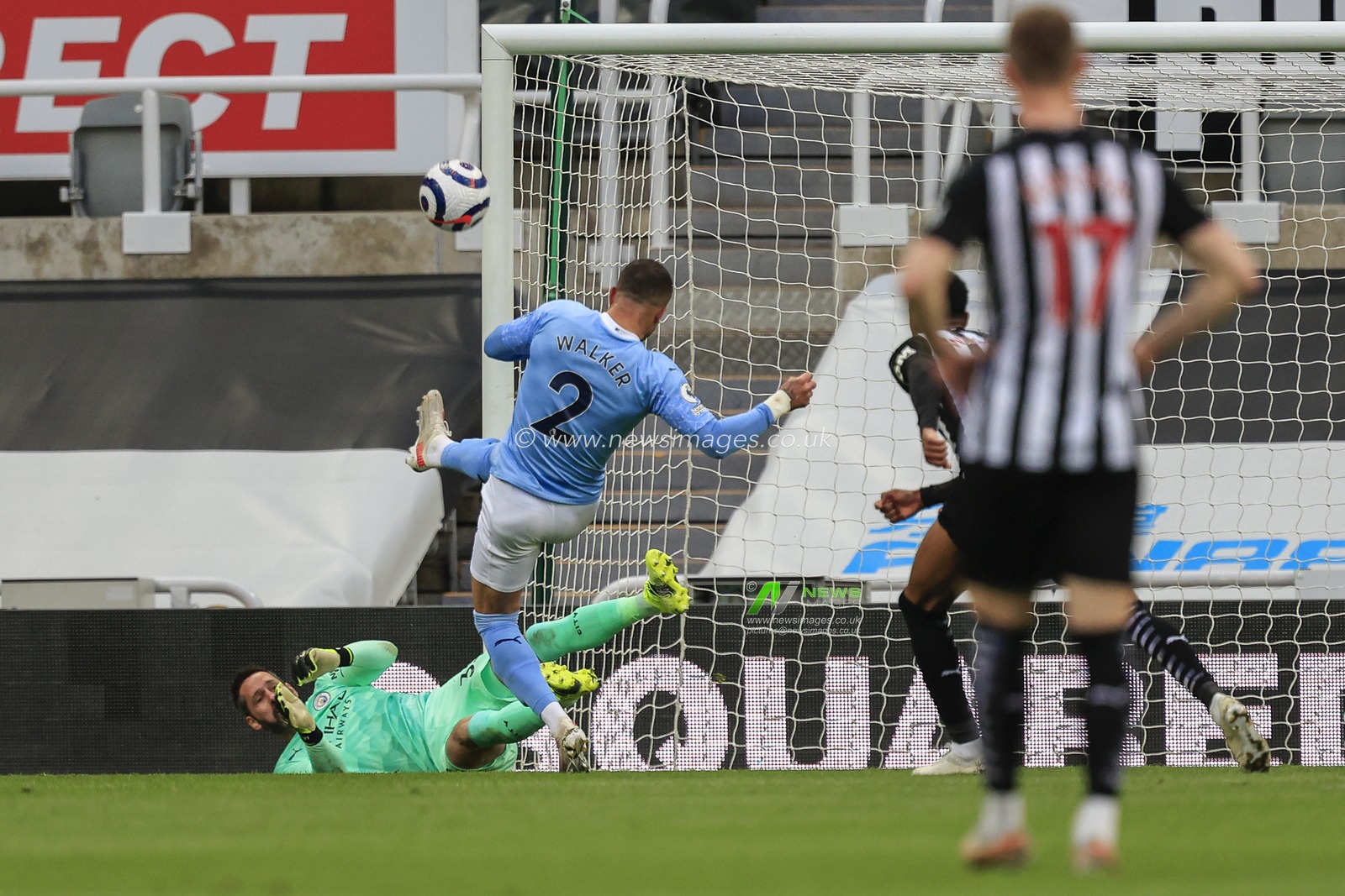 Kyle Walker #2 of Manchester City clears the ball after the ball hit the crossbar