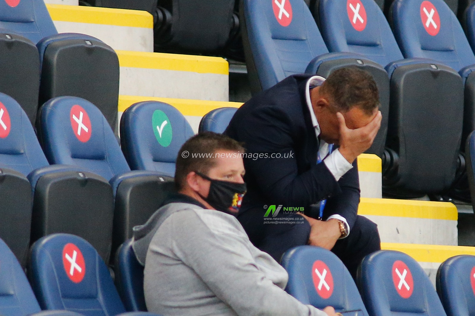 Adrian Lam (Coach) of Wigan Warriors, looks dejected following defeat against Hull KR.