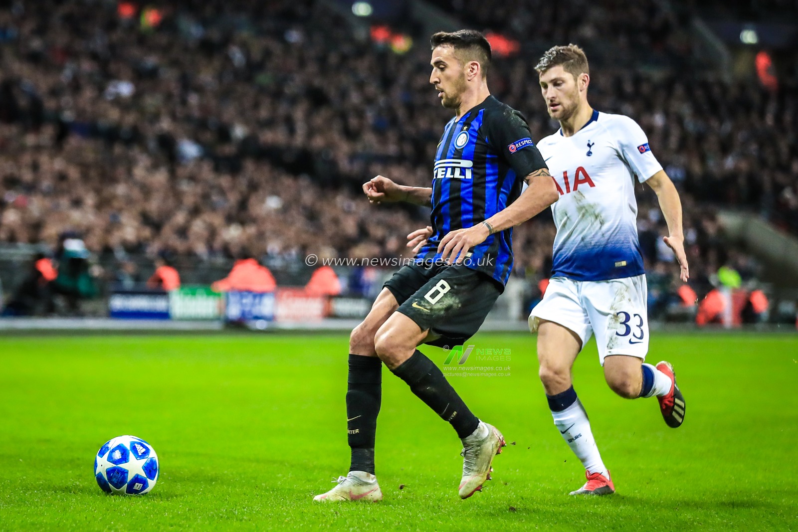 28th November 2018, Wembley Stadium, London, England; UEFA Champions League, Tottenham v Inter Milan ; Ben Davies (33) of Tottenham marks Matias Vecino (08) of Inter Milan 


Credit: Georgie Kerr/News Images