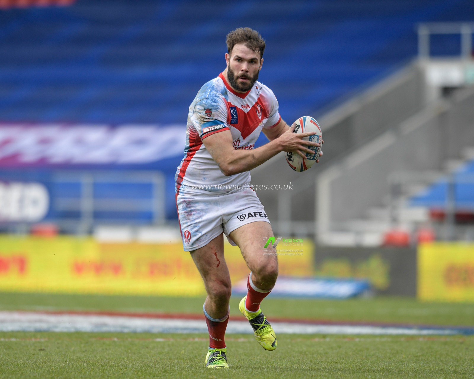 Alex Walmsley (8) of St Helens runs with the ball