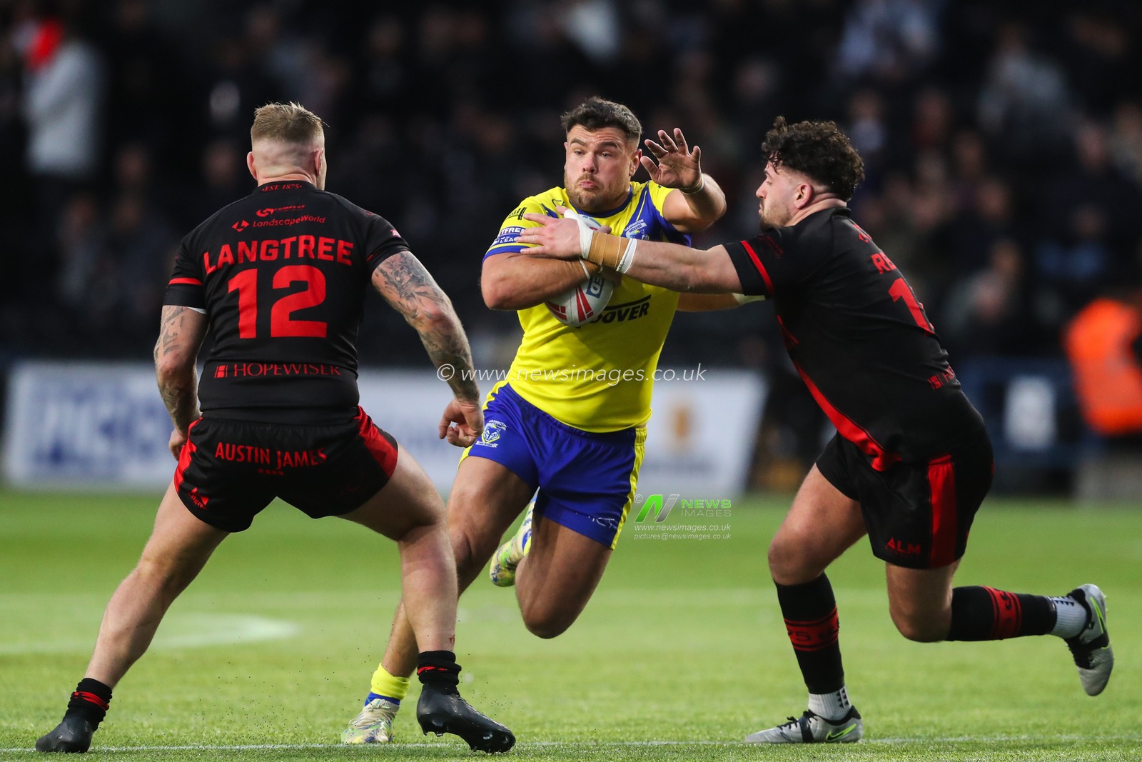 Joe Philbin of Warrington Wolves is tackled during the Betfred Challenge Cup match Widnes Vikings vs Warrington Wolves at DCBL Stadium, Widnes, United Kingdom, 15th March 2025

(Photo by Gareth Evans/News Images)