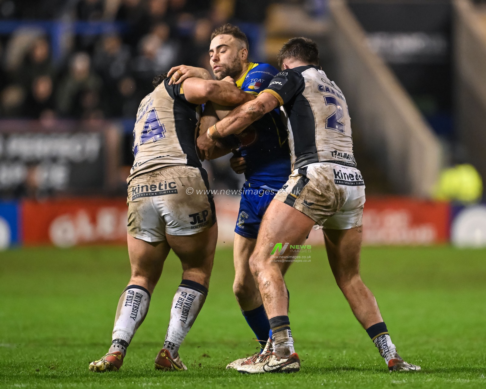 James Harrison of Warrington Wolves is tackled by Liam Tindall Hull FC and Nick Staveley Hull FC during the Betfred Super League Round 2 match Warrington Wolves vs Hull FC at Halliwell Jones Stadium, Warrington, United Kingdom, 23rd February 2024

(Photo by Craig Thomas/News Images)