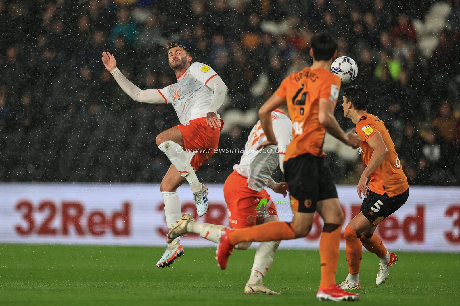 Gary Madine #14 of Blackpool heads on goal