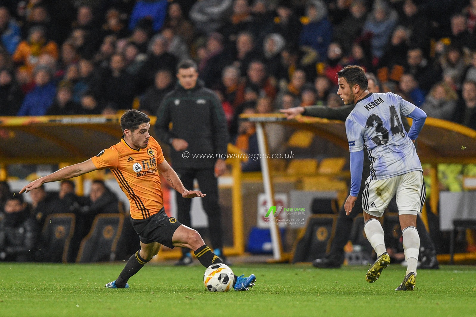 12th December 2019, Molineux, Wolverhampton, England; UEFA Europa League, Wolverhampton Wanderers v Besiktas : Pedro Neto (7) of Wolverhampton Wanderers intercepts the ball from Kerem Kalafat (34) of Besiktas 

Credit: Richard Long/News Images
