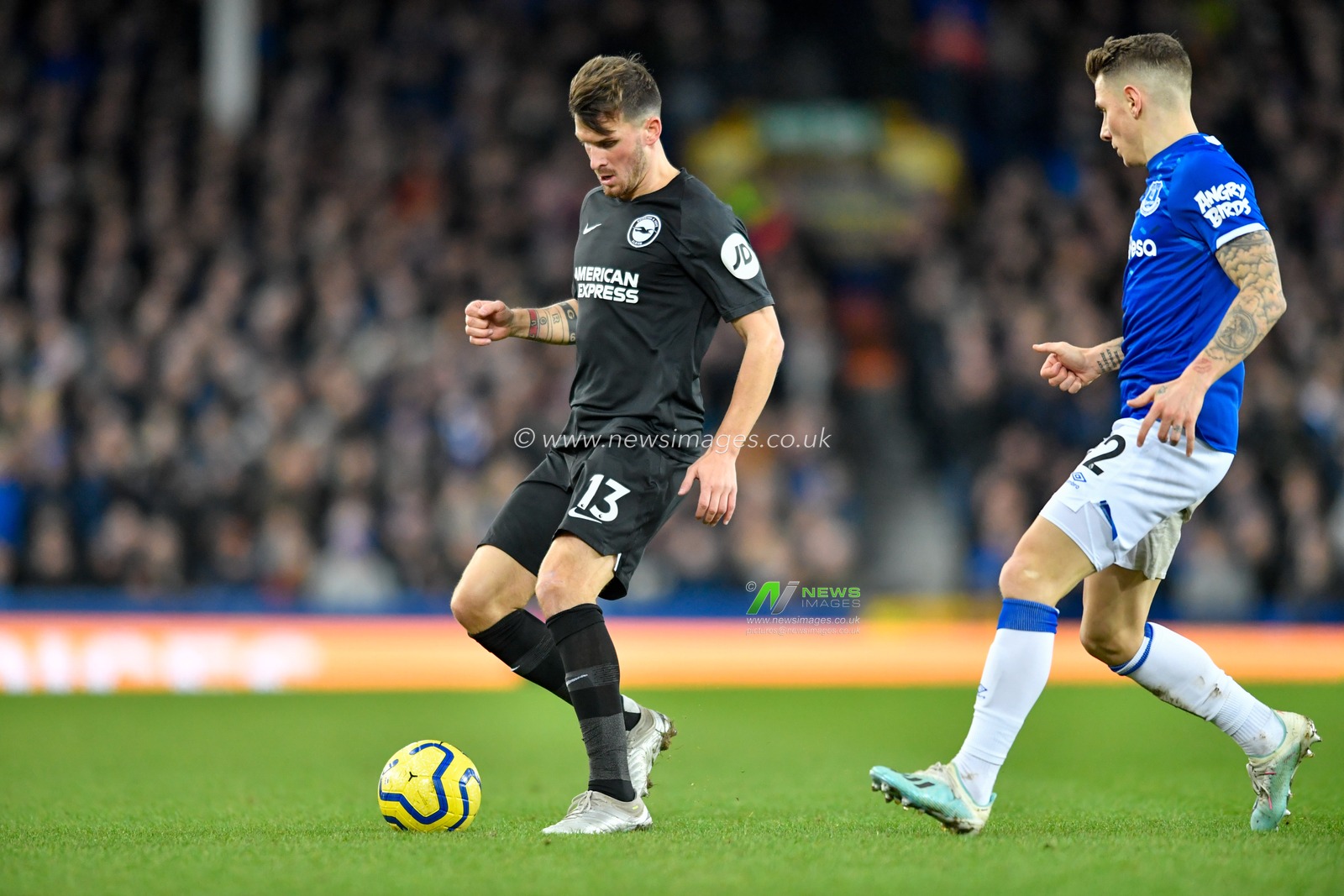11th January 2020, Goodison Park, Liverpool, England; Premier League, Everton v Brighton and Hove Albion : Pascal Gross (13) of Brighton and Hove Albion shields the ball from Lucas Digne (12) of Everton

Credit: Simon Whitehead/News Images