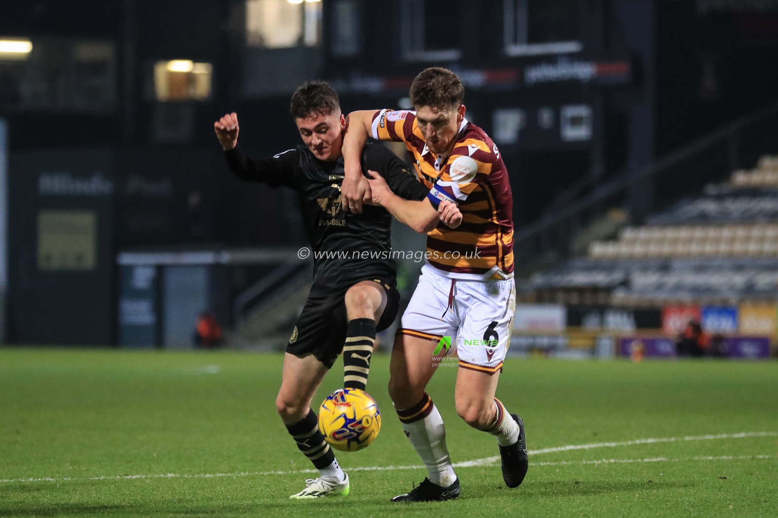 Aaron Atkinson #40 of Barnsley and Richard Smallwood #6 of Bradford City battle for the ball during the Bristol Street Motors Trophy match Bradford City vs Barnsley at University of Bradford Stadium, Bradford, United Kingdom, 21st November 2023

(Photo by Alfie Cosgrove/News Images)