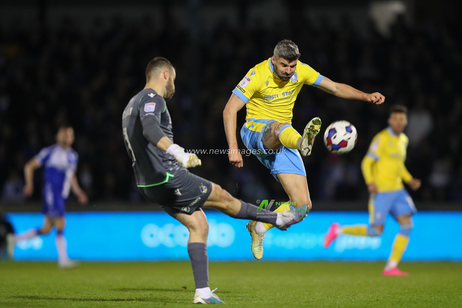 Callum Paterson #13 of Sheffield Wednesday pressures James Belshaw #1 of Bristol Rovers during the Sky Bet League 1 match Bristol Rovers vs Sheffield Wednesday at Memorial Stadium, Bristol, United Kingdom, 18th April 2023

(Photo by Gareth Evans/News Images)