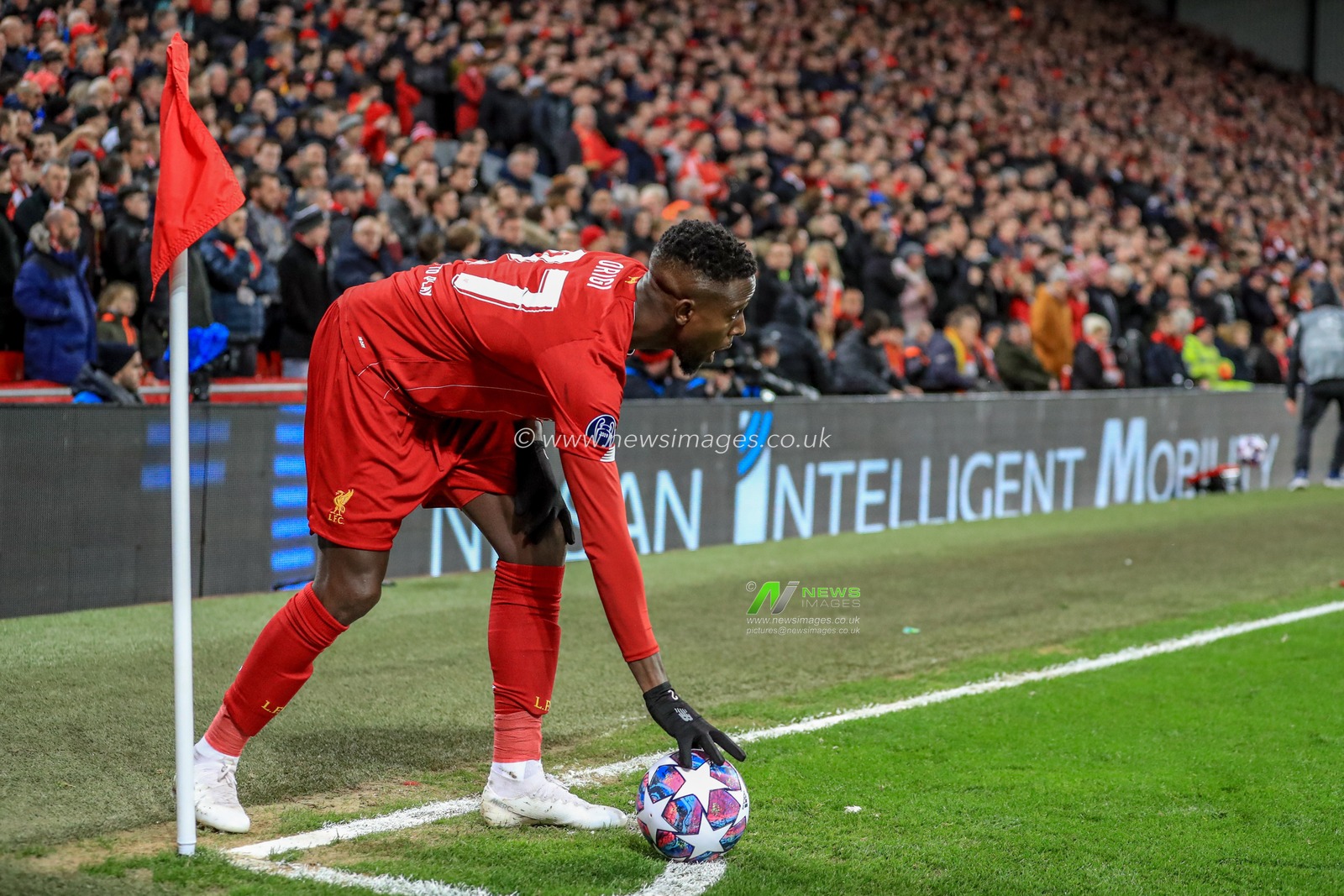11th March 2020, Anfield, Liverpool, England; UEFA Champions League, Round of 16 Leg 2 of 2, Liverpool v Atletico Madrid : Divock Origi (27) of Liverpool places the ball to take a corner