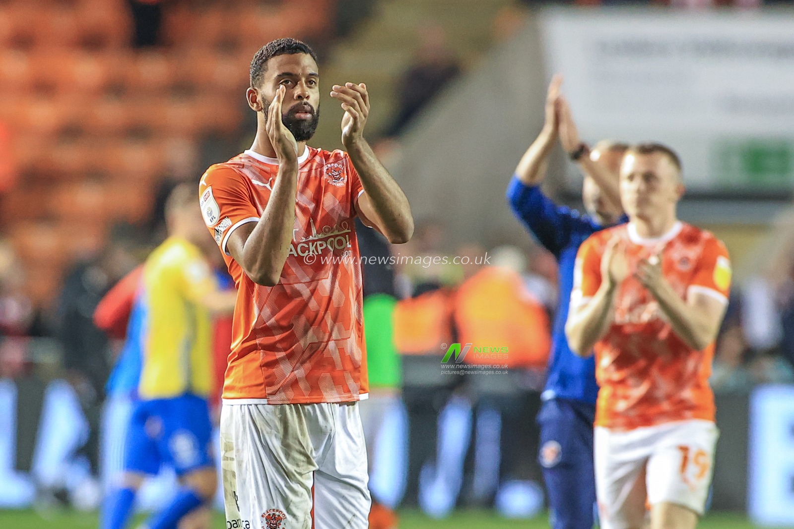 Cj Hamilton #22 of Blackpool applauds the fans after the final whistle
