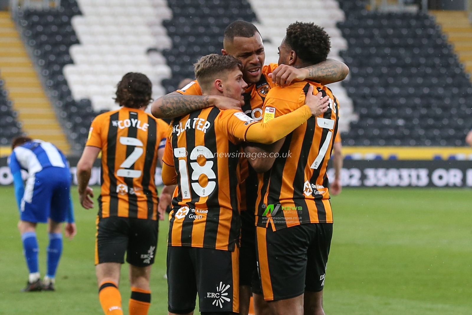 Josh Magennis #27 of Hull City celebrates with Regan Slater #18 and Mallik Wilks #7 of Hull City