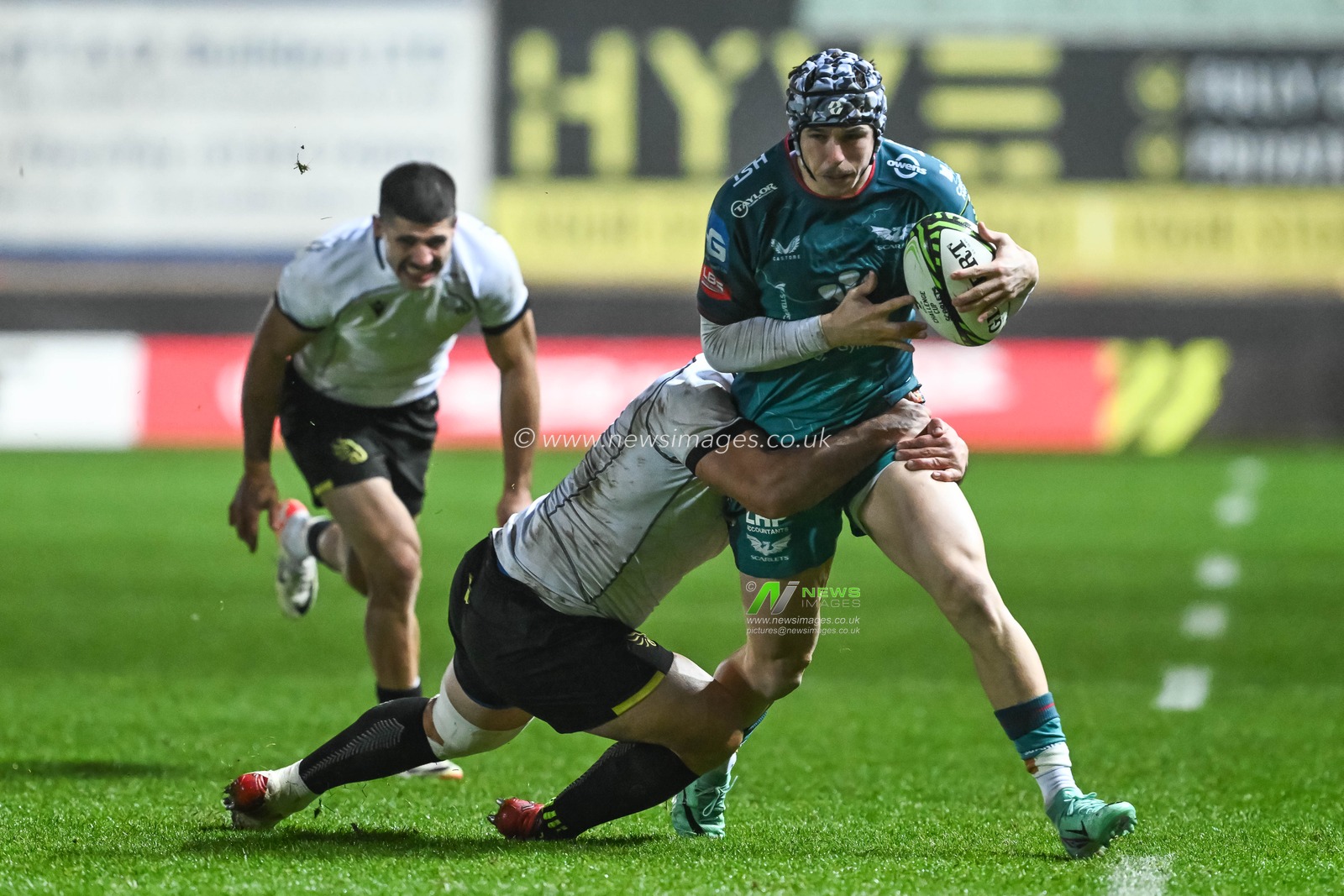 Tom Rogers of Scarlets is tackled by Nodar Cheishvili of Black Lion  during the European Rugby Challenge Cup match Llanelli Scarlets vs Black Lion at Parc y Scarlets, Llanelli, United Kingdom, 15th December 2023

(Photo by Craig Thomas/News Images)