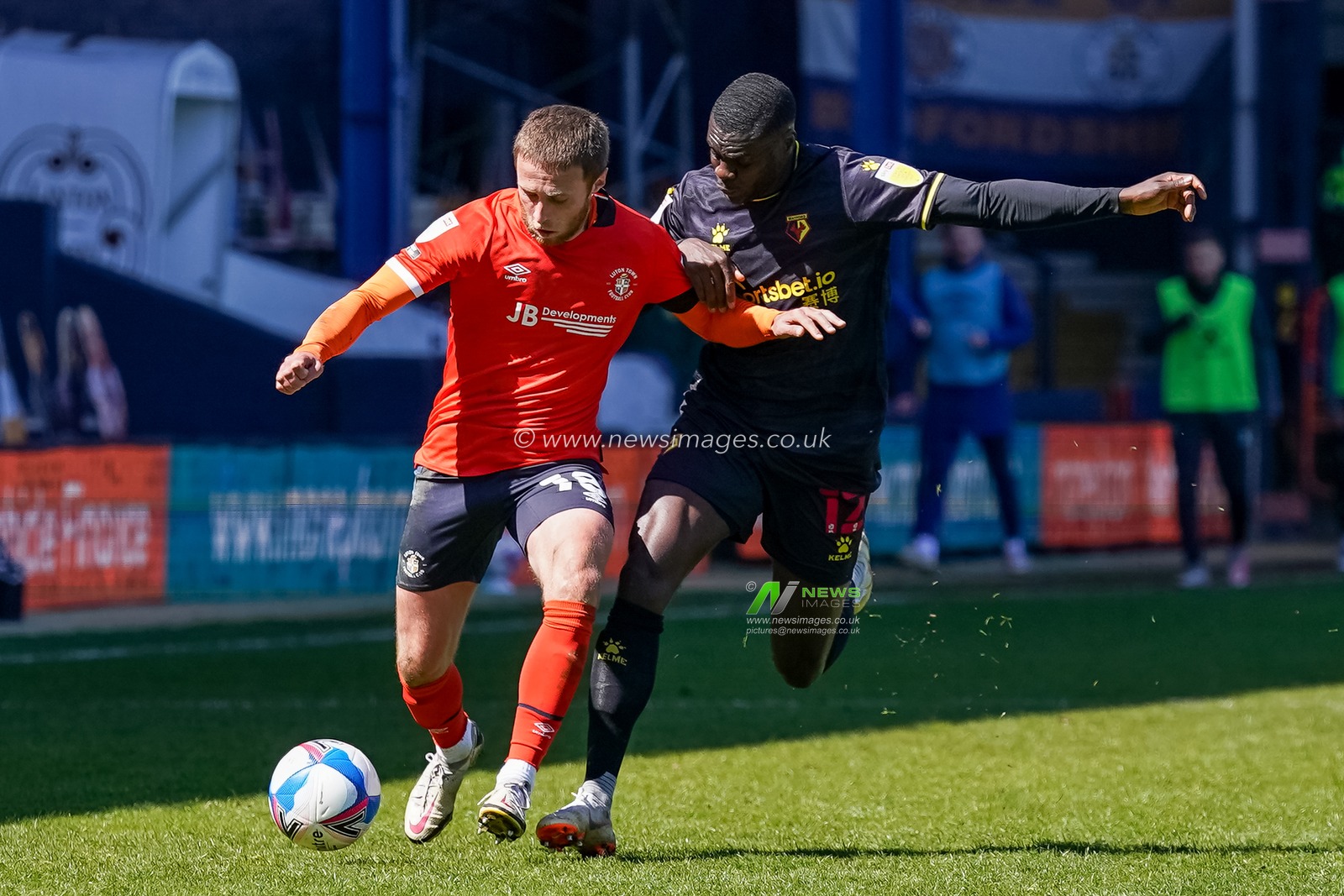 Jordan Clark #18 of Luton Town battles with Achraf Lazaar #17 of Watford
