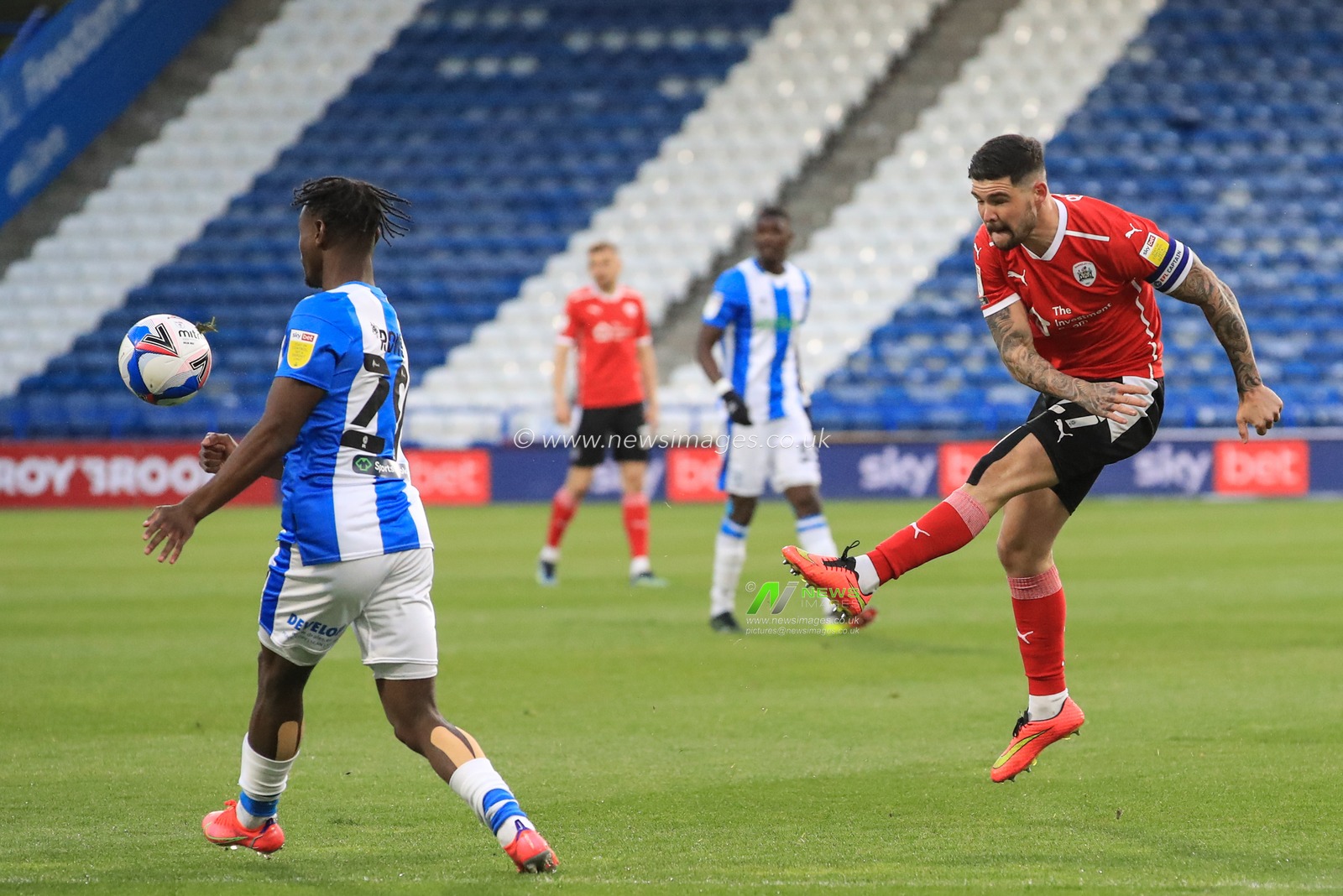 Alex Mowatt #27 of Barnsley shoots on goal and its deflected back out