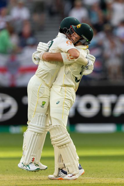 Travis Head of Australia is congratulated by his teammate for a brilliant innings after he got out during the NRMA Insurance Ashes First Test Day 2 Australia vs England at Optus Stadium, Perth, Australia, 22nd November 2025

(Photo by Santanu Banik/News Images)

*** GER AUT SUI OUT ***