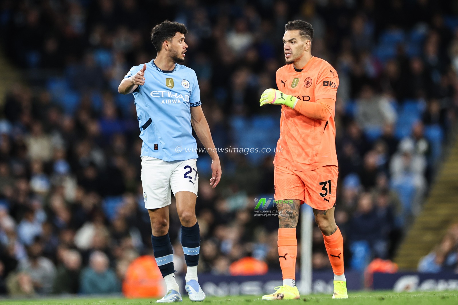 Matheus Nunes of Manchester City talks to Ederson of Manchester City during the Premier League match Manchester City vs Leicester City at Etihad Stadium, Manchester, United Kingdom, 2nd April 2025

(Photo by Mark Cosgrove/News Images)