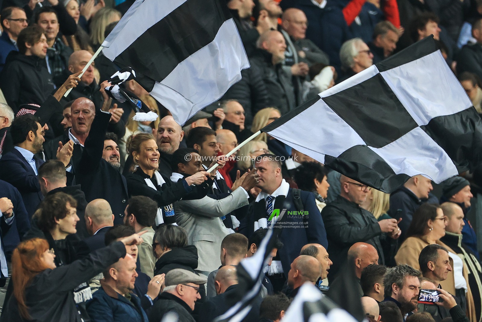 Amanda Staveley Newcastle owner waves a flag as she celebrates the win