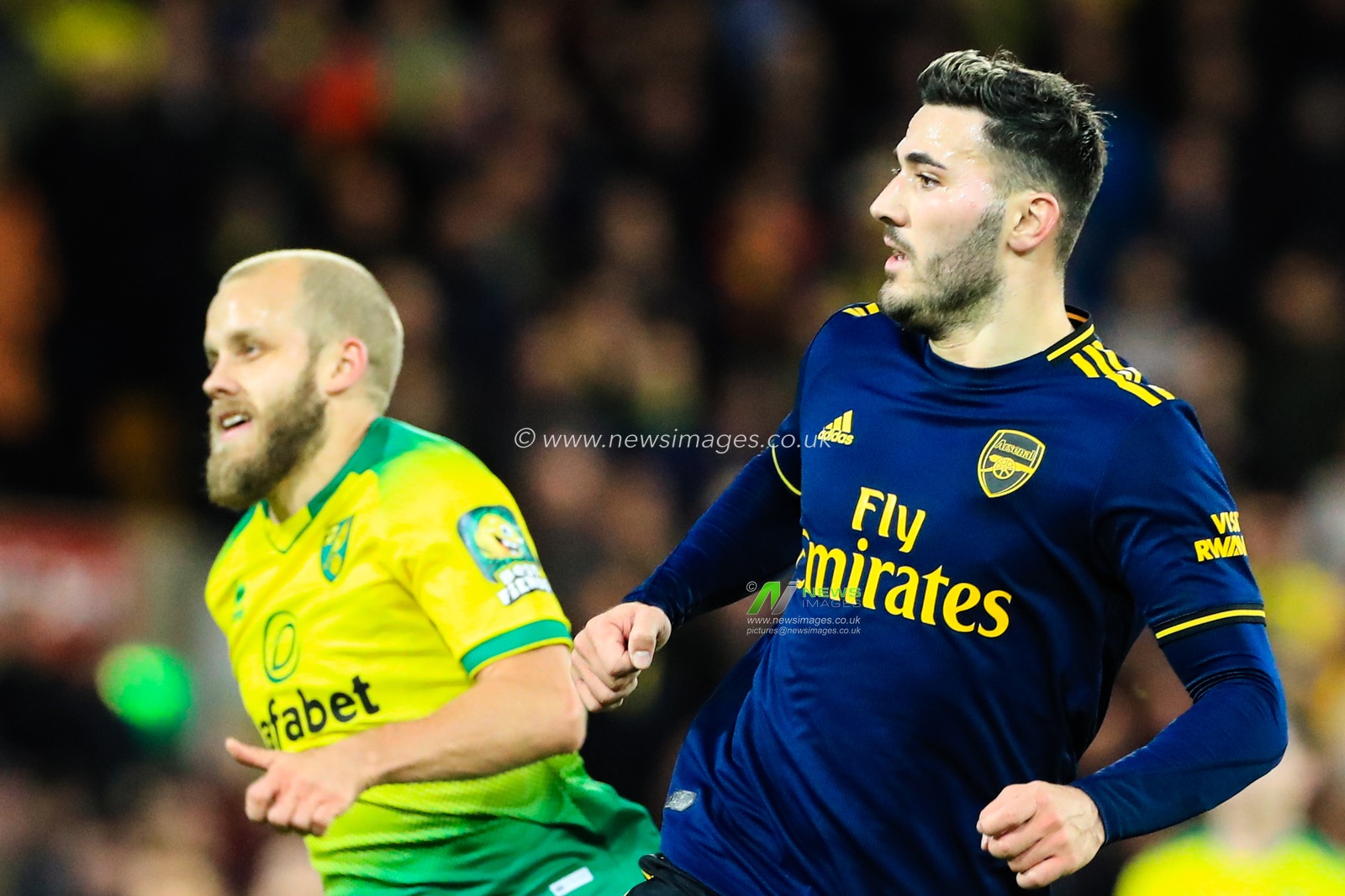 1st December 2019, Carrow Road, Norwich, England; Premier League, Norwich City v Arsenal : Sead Kolasinac (31) of Arsenal and Teemu Pukki (22) of Norwich City

Credit: Georgie Kerr/News Images