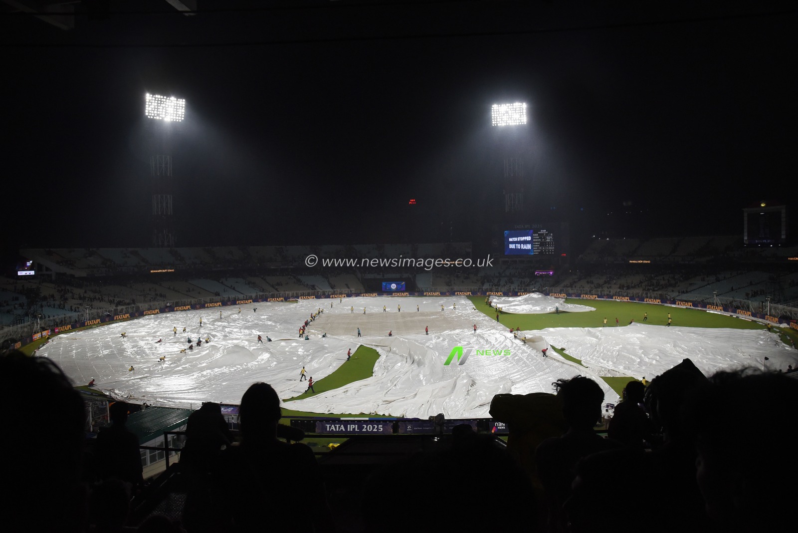 The ground staff work to keep the pitch dry as play is tries to stop the ball due to rain during the 2025 IPL match between Kolkata Knight Riders and Punjab Kings at Eden Gardens on April 26, 2025, in Kolkata, India. Photo by Debajyoti Chakraborty.(Photo: Debajyoti Chakraborty/News Images)