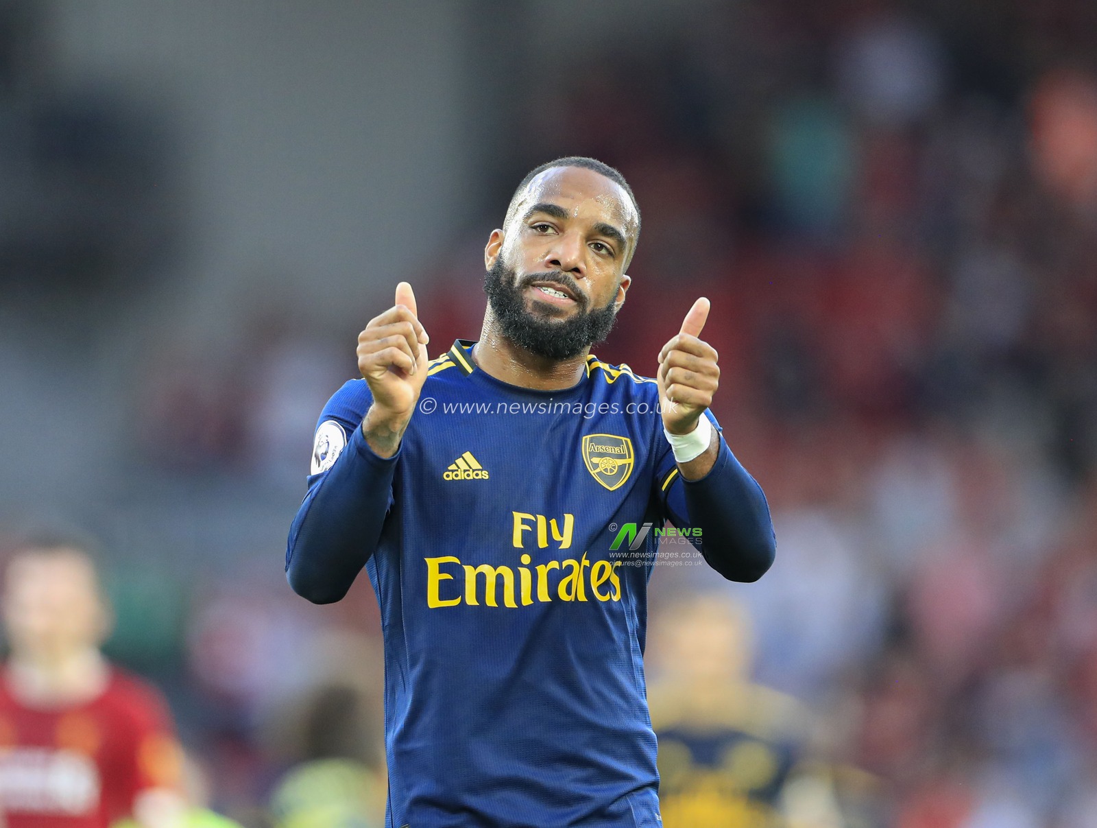 23rd August 2019 , Anfield, Liverpool, England; Premier League Football, Liverpool vs Arsenal ;  Alexandre Lacazette (9) of Arsenal applauds the fans at the end of the game

Credit: Conor Molloy/News Images 


Premier League/EFL Football images are subject to DataCo Licence