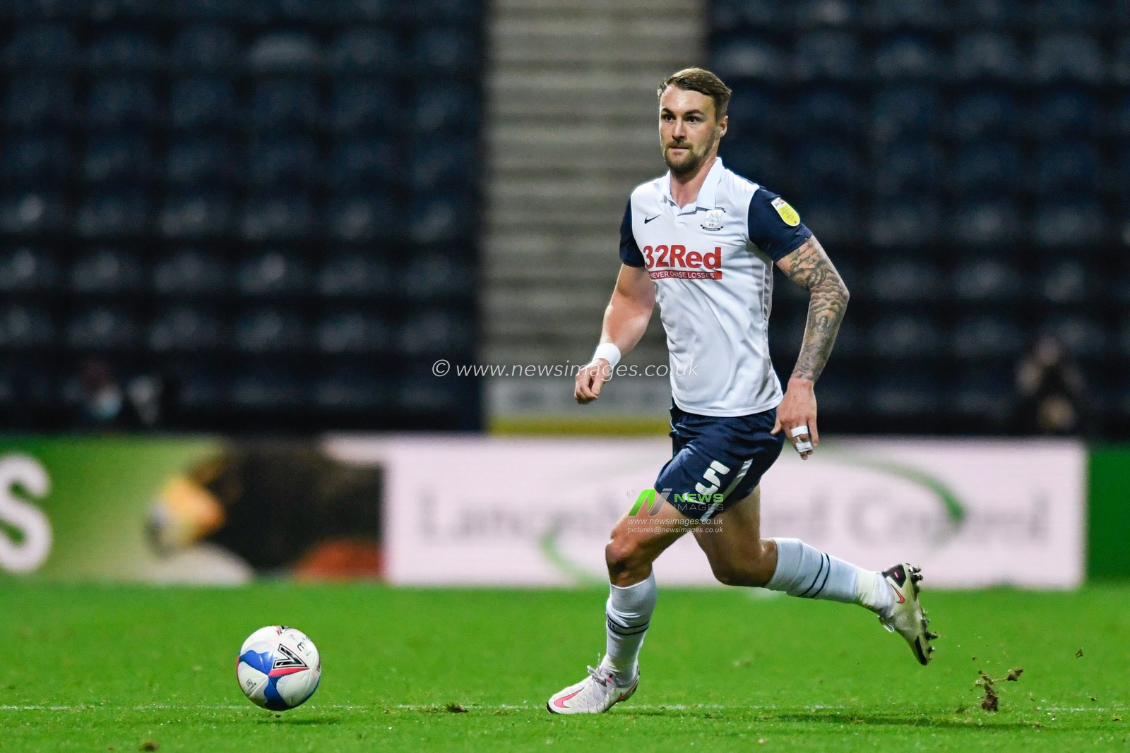 Patrick Bauer #5 of Preston North End runs with the ball
