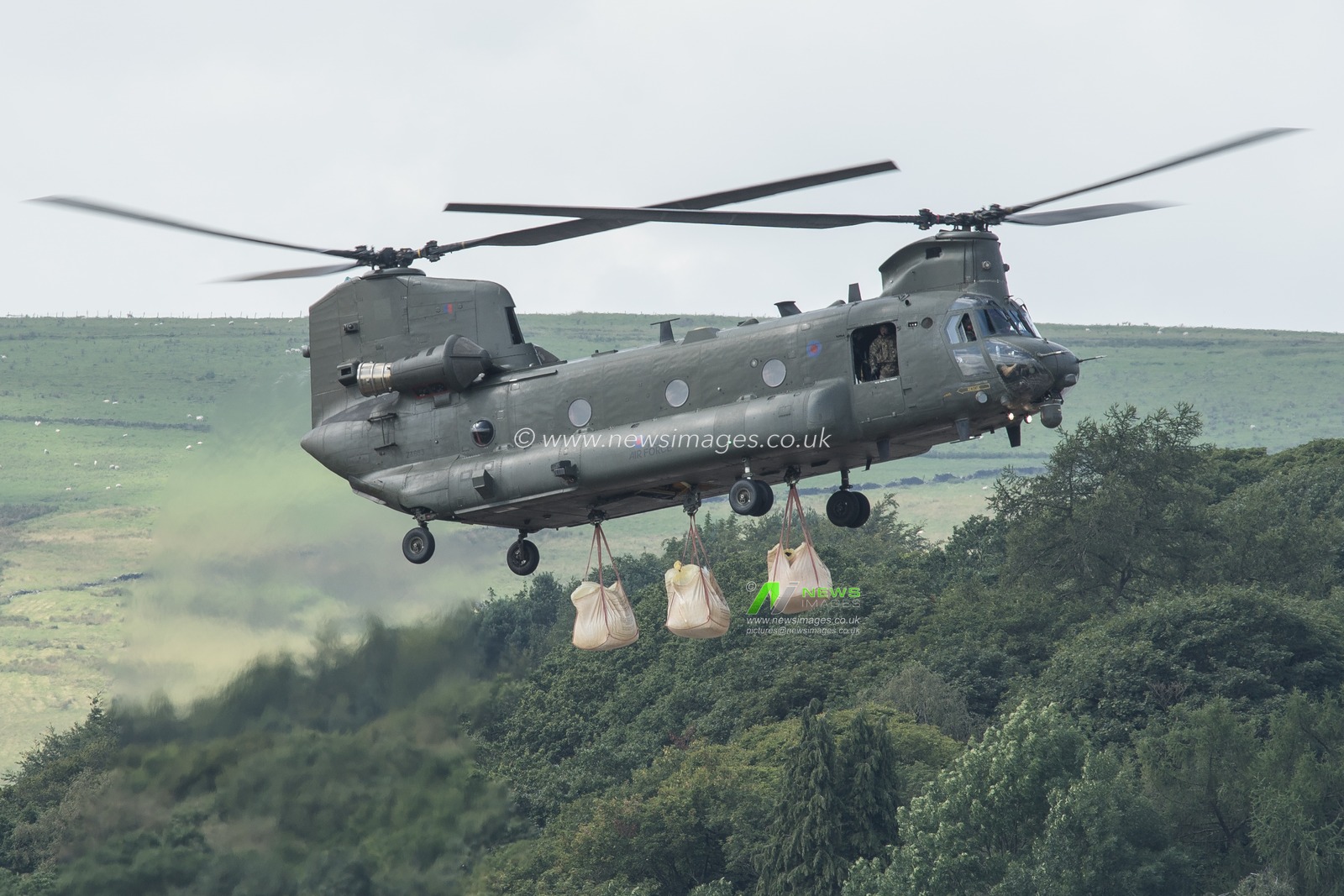 6th August 2019 , Whaley Bridge dam, Whaley Bridge, United Kingdom , Whaley Bridge dam repairs after a heavy flood : A RAF CH-47 Chinook helicopter carries sandbags to Whaley Bridge dam to carry out major emergency repairs after the recent heavy flood waters caused a partial collops of the dam head 

Credit: Kurt Fairhurst/News Images
