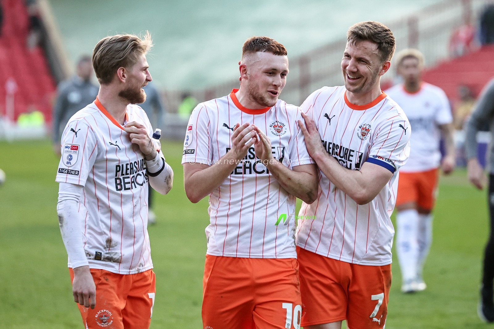 Hayden Coulson of Blackpool and Lee Evans of Blackpool celebrate their 0-3 win with goalscorer Sonny Carey of Blackpool during the Sky Bet League 1 match Barnsley vs Blackpool at Oakwell, Barnsley, United Kingdom, 8th March 2025

(Photo by Mark Cosgrove/News Images)