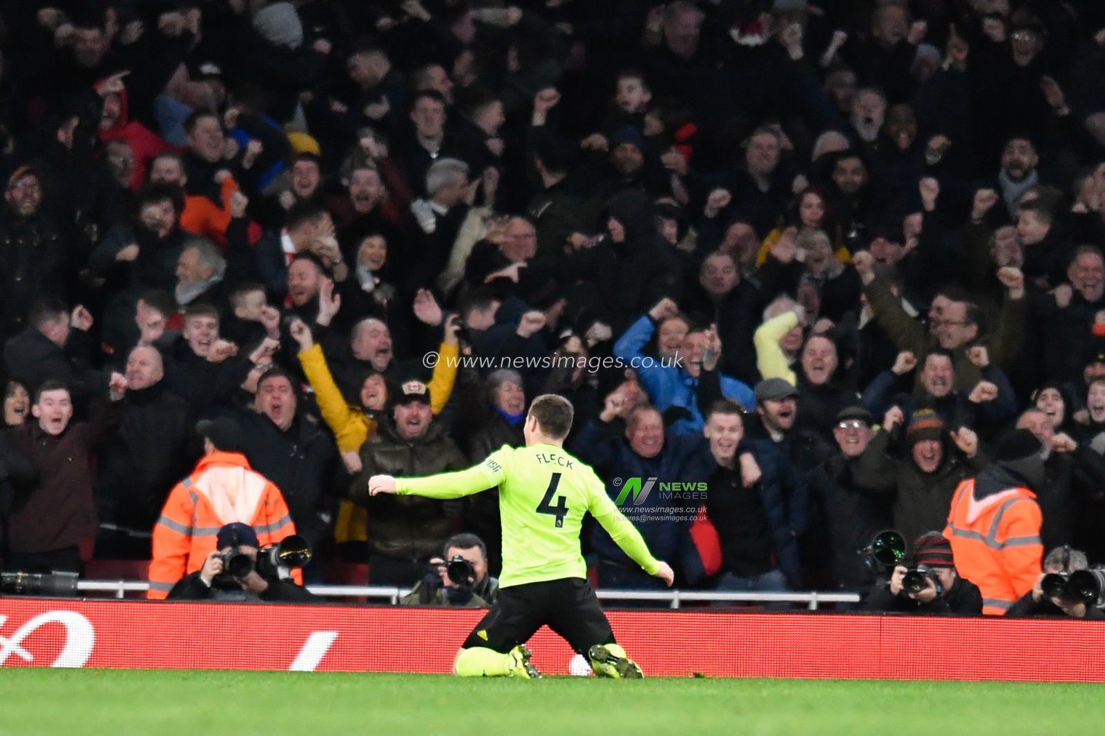 18th January 2020, Emirates Stadium, London, England; Premier League, Arsenal v Sheffield United : John Fleck (4) of Sheffield United celebrates on his knees in front of the travelling supporters

Credit: Simon Whitehead/News Images