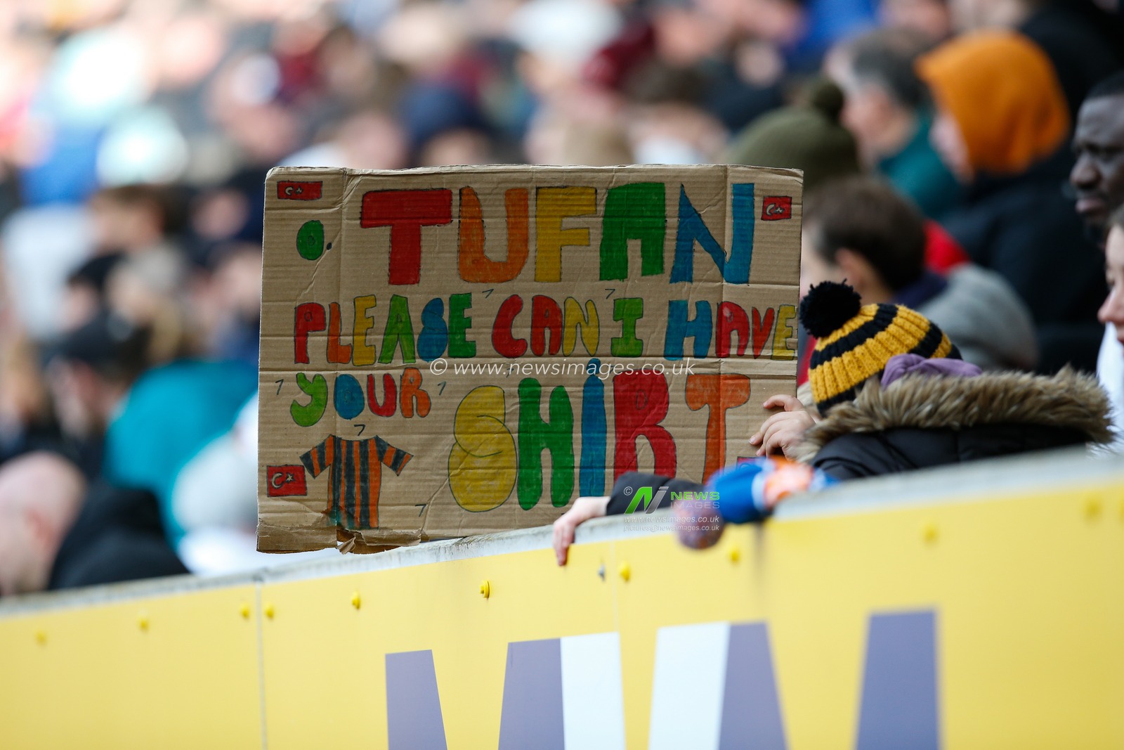 A fan holds up a banner asking for the shirt of Ozan Tufan #7 of Hull City during the Sky Bet Championship match Hull City vs Millwall at MKM Stadium, Hull, United Kingdom, 10th April 2023

(Photo by Ben Early/News Images)