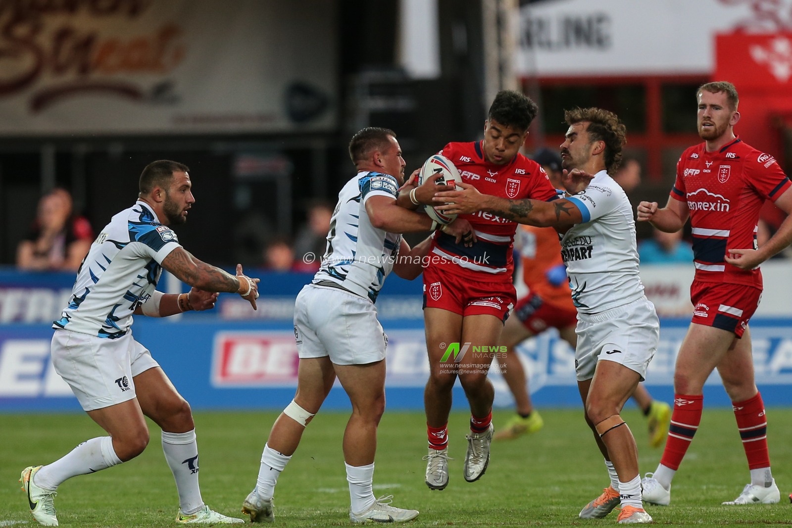 Phoenix Laulu-Togaga'e  #29 of Hull KR is tackled by the Toulouse defence