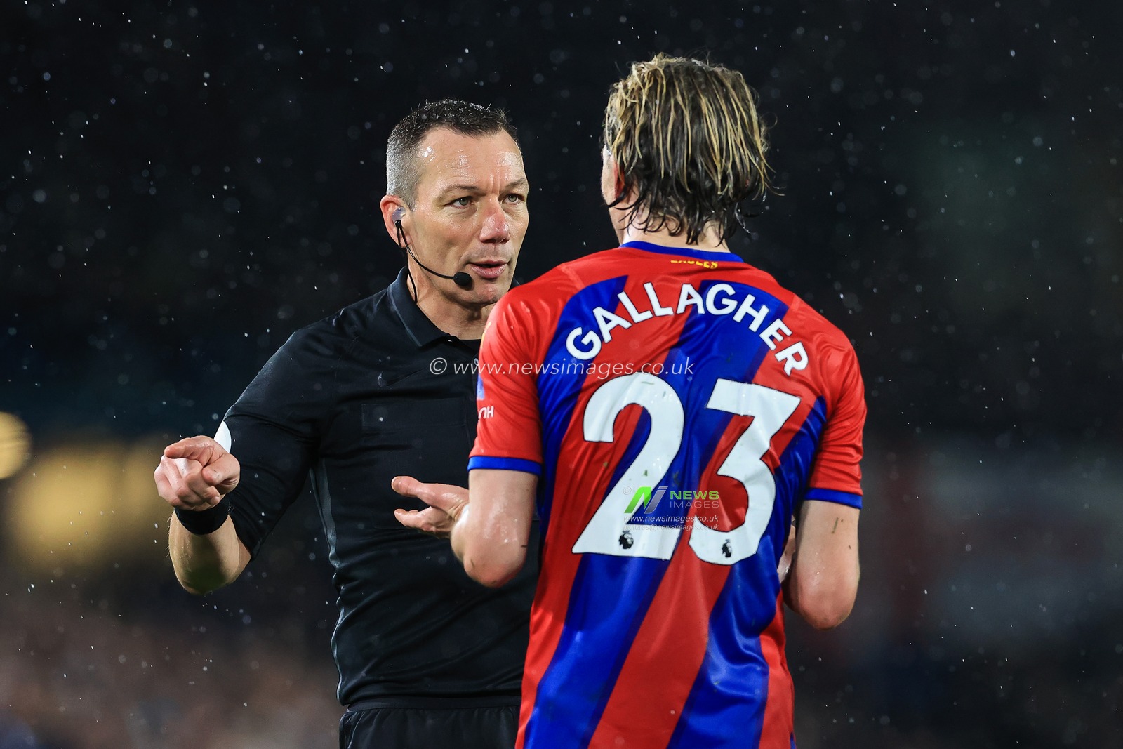Referee Kevin Friend speaks to Conor Gallagher #23 of Crystal Palace
