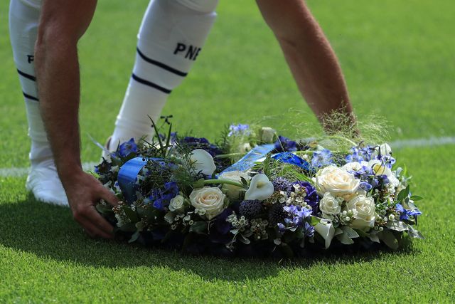Lewis Gibson of Preston North End lays wreath infant of away fans in tribute to Diogo Jota and Andre Silva during the Pre-season friendly match Preston North End vs Liverpool at Deepdale, Preston, United Kingdom, 13th July 2025

(Photo by Jorge Horsted/News Images)