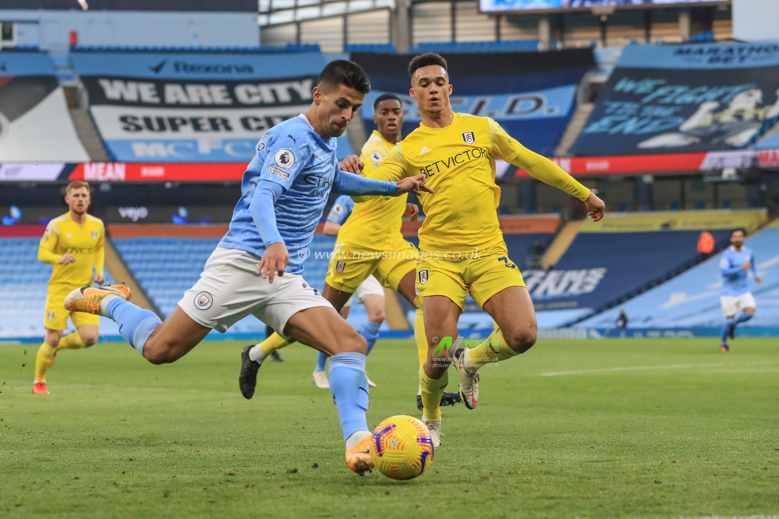 Joao Cancelo #27 of Manchester City looks for a shot