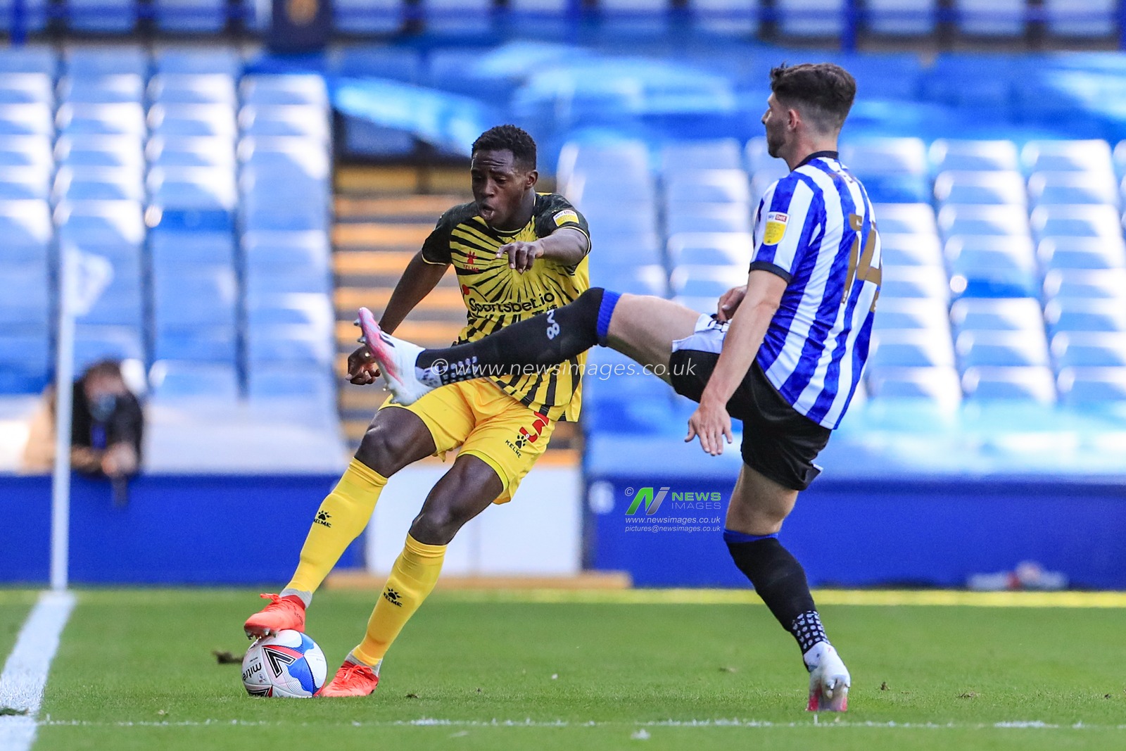 Jeremy Ngakia (3) of Watford  is challenged by Matt Penney (14) of Sheffield Wednesday