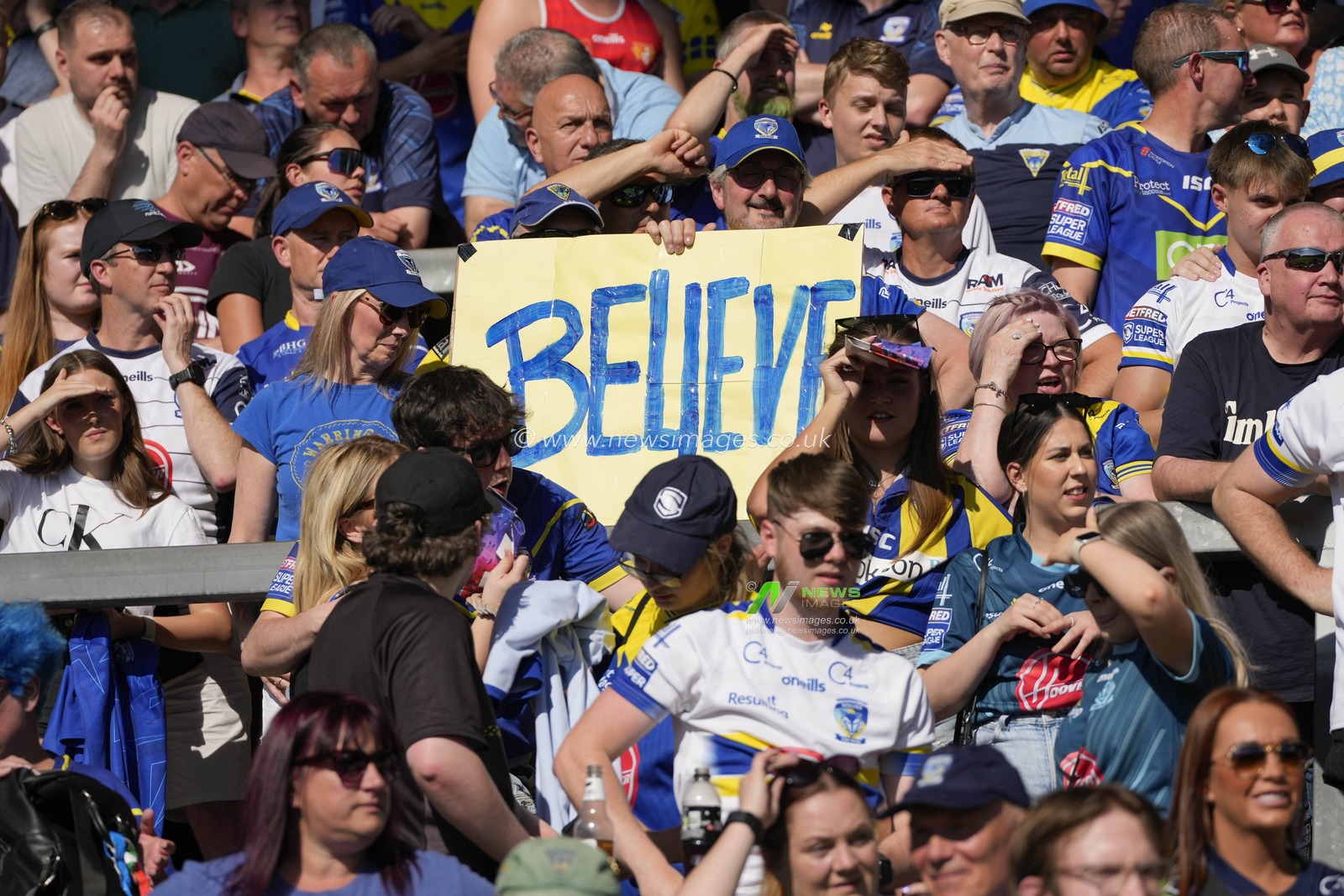 Warrington Wolves fans celebrate their sides victory after the Betfred Challenge Cup Semi-Final match Huddersfield Giants vs Warrington Wolves at Totally Wicked Stadium, St Helens, United Kingdom, 19th May 2024

(Photo by Steve Flynn/News Images)