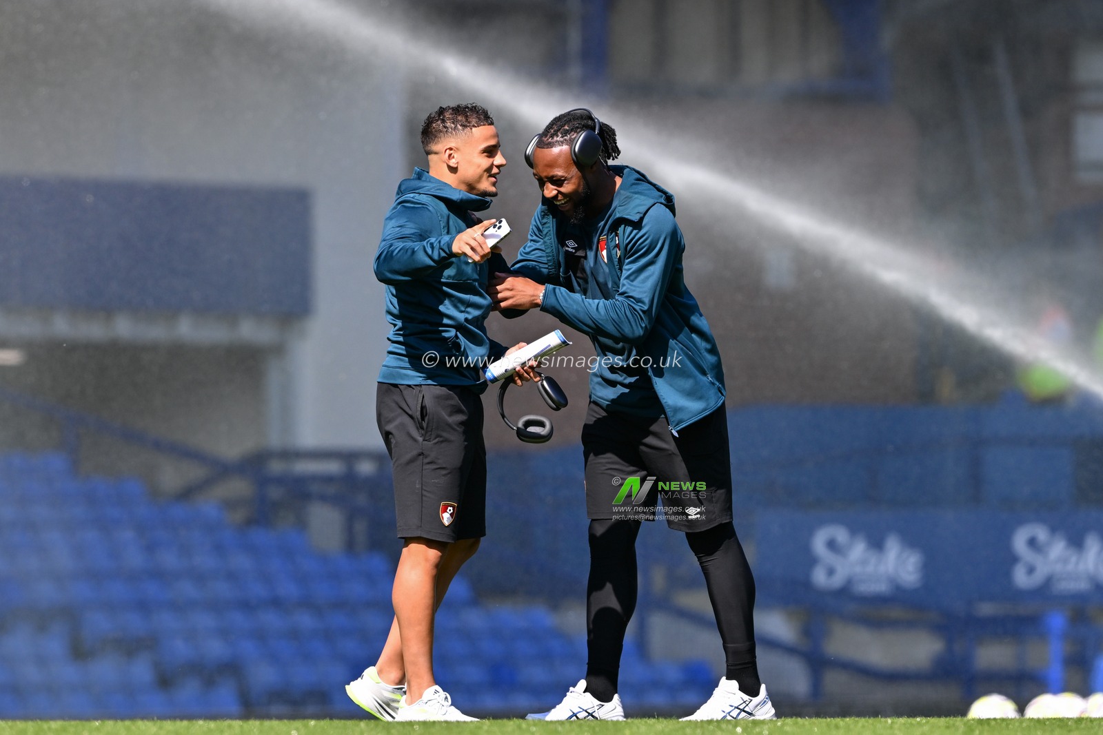 Justin Kluivert of Bournemouth and Antoine Semenyo of Bournemouth share a joke as they inspect the pitch ahead of the Premier League match Everton vs Bournemouth at Goodison Park, Liverpool, United Kingdom, 31st August 2024

(Photo by Cody Froggatt/News Images)