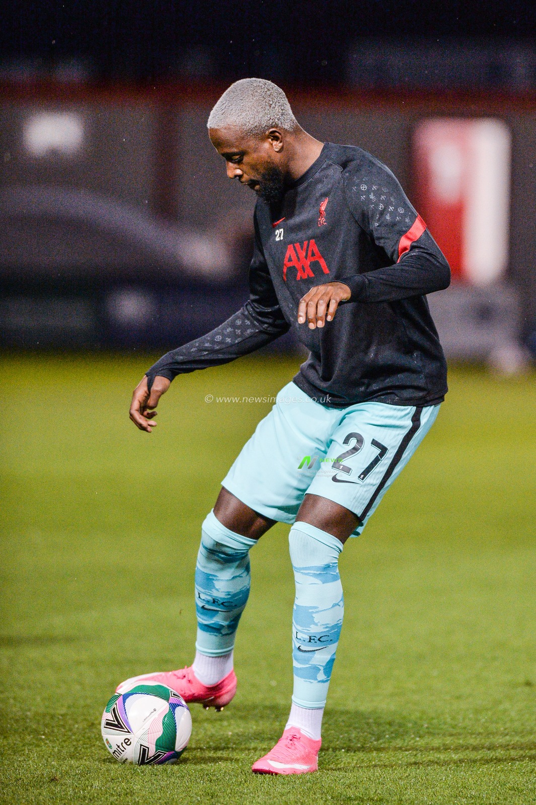Divock Origi (27) of Liverpool warms up.