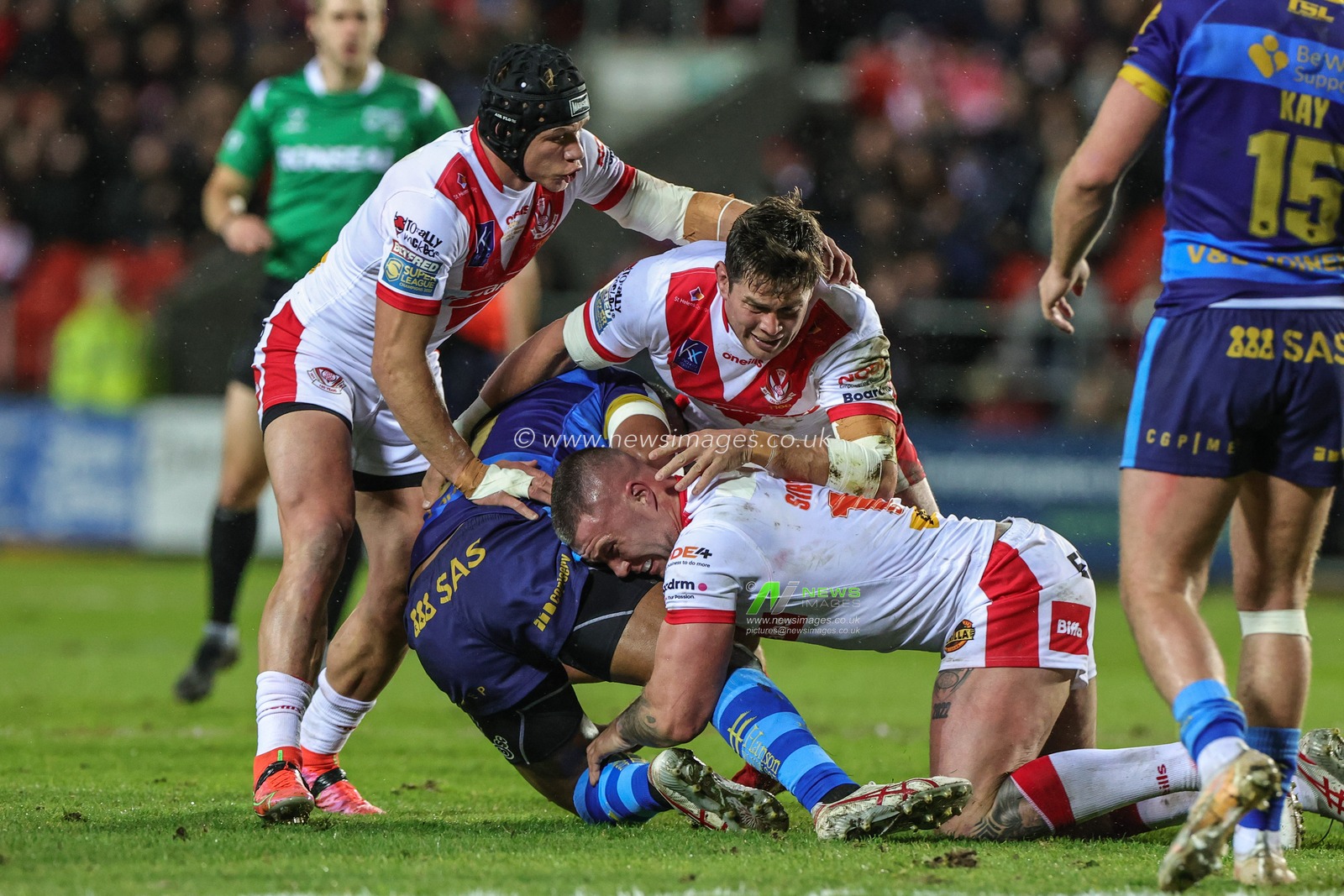 Samisoni Langi #21 of Wakefield Trinity is tackled by Curtis Sironen #16 of St Helens and Louie McCarthy-Scarsbrook #15 of St Helens during the Betfred Super League Round 7 match St Helens vs Wakefield Trinity at Totally Wicked Stadium, St Helens, United Kingdom, 31st March 2023

(Photo by Mark Cosgrove/News Images)