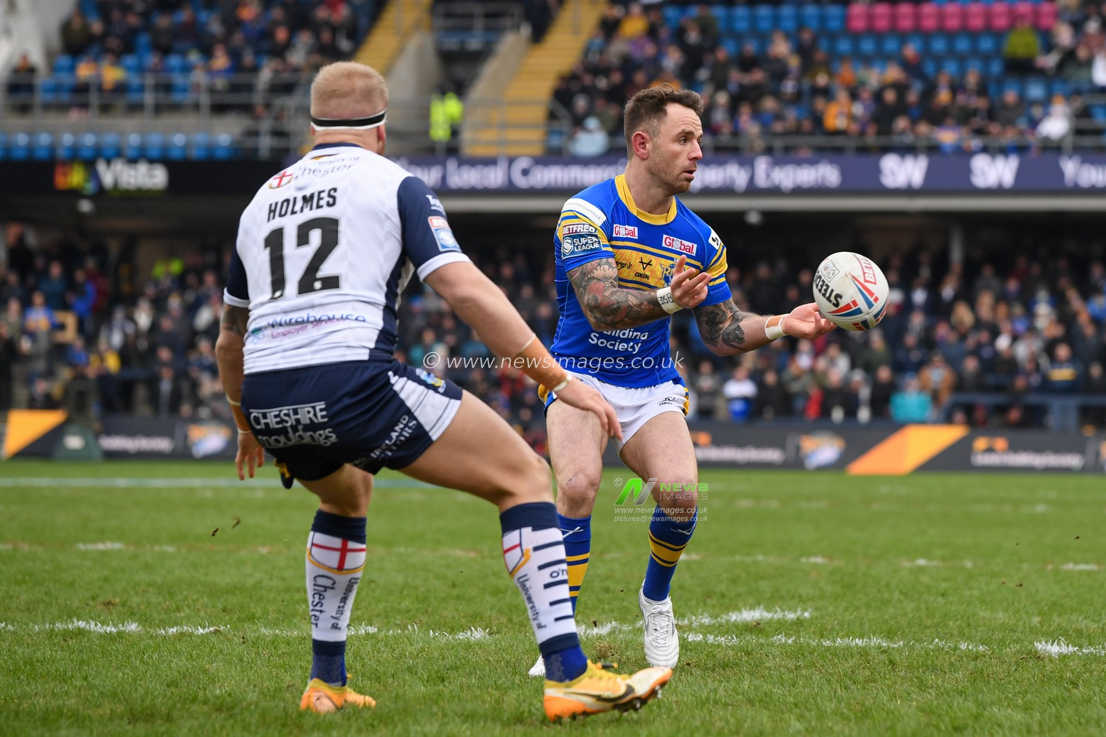Richie Myler #16 of Leeds Rhinos passes the ball